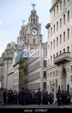 A military band lead the 1st Battalion of The Duke Of Lancaster's Regiment as they march through the streets of Liverpool to Our Lady & Saint Nicholas Church before observing a two minute silence to remember the war dead on Armistice Day. Picture date: Thursday November 11, 2021. Stock Photo