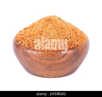 Coconut sugar isolated on white background. Brown unrefined coconut palm sugar in wooden bowl Stock Photo