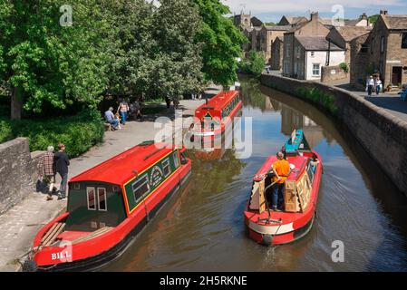 Canal UK, view in summer of colourful narrow boats on the Springs Branch Canal in Skipton, North Yorkshire, England, UK Stock Photo