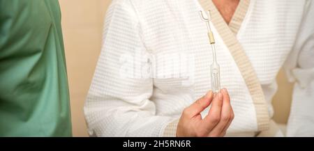 Young caucasian man receiving nasal inhalation Maholda with essential oil in the nose at a hospital Stock Photo
