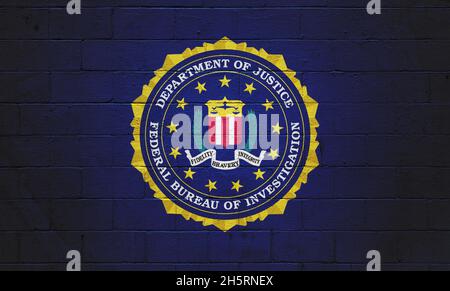 The FBI flag (Federal Bureau of Investigation) painted on a brick wall. Stock Photo