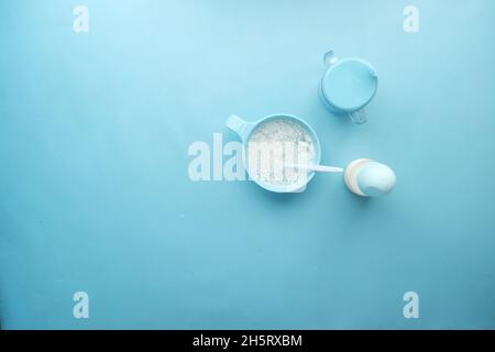 Close up of baby food in a bowl on blue background  Stock Photo