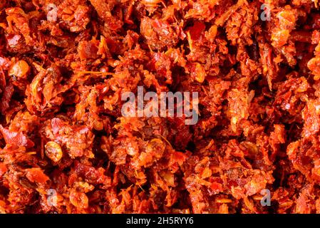 spicy maldives fish chips or flakes condiment, made with chili peppers, tomato, ginger, garlic and salt, fresh food background texture, closeup Stock Photo