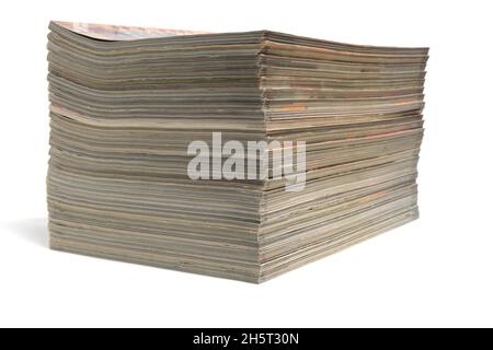 Stack of magazines and newspapers on a white background Stock Photo