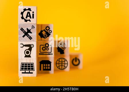 Artificial intelligence signs on wooden cubes, yellow background. The concept of artificial intelligence, the future. Stock Photo