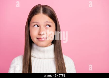 Portrait of attractive cheery sly cunning brown-haired girl making decision isolated over pink pastel color background Stock Photo