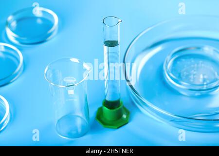 Medical abstract blue background from flasks, test tubes and petri dishes Stock Photo