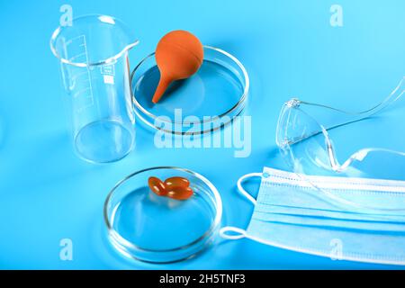 Medical abstract blue background from flasks, test tubes and petri dishes Stock Photo