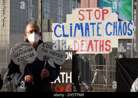 Glasgow, Scotland, UK. 11th Nov, 2021. On remembrance day climate activists gathered outside the entrance to COP26 climate summit in Glasgow to remember all those who have died due to the effects of climate change. (Credit Image: © Rod Harbinson/ZUMA Press Wire) Credit: ZUMA Press, Inc./Alamy Live News Stock Photo