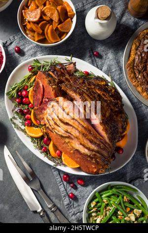 Homemade Christmas Ham Dinner with Potatoes Cranberry and Pecan Pie Stock Photo