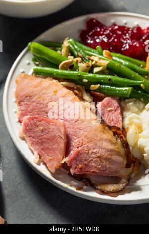 Homemade Christmas Ham Dinner with Potatoes Cranberry and Pecan Pie Stock Photo