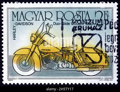 HUNGARY - CIRCA 1985: a stamp printed in Hungary shows Harley-Davidson duo-glide, from 1960, motorcycle, circa 1985 Stock Photo