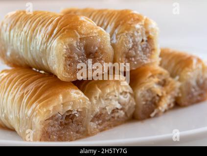 View of the Turkish baklava in the form of mini rolls. Close-up Stock Photo
