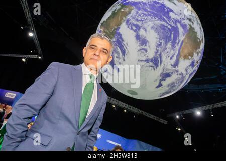 Glasgow, UK. 11th Nov, 2021. Sadiq Khan, Mayor of London, stands under a globe at the UN Climate Change Conference COP26. The World Climate Conference is taking place in Glasgow. Around 200 countries are negotiating how to curb the global climate crisis and global warming. Credit: Christoph Soeder/dpa/Alamy Live News Stock Photo