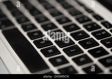 photo of a black qwerty keyboard on a silver background Stock Photo