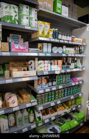 Vegan corner shop with a large variety of products on shelves and fridges Stock Photo