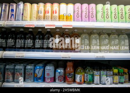 Vegan corner shop with a large variety of products on shelves and fridges Stock Photo