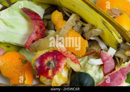 Organic waste from vegetables and fruits. Garbage for composting. Peels and cobs from organics. Stock Photo