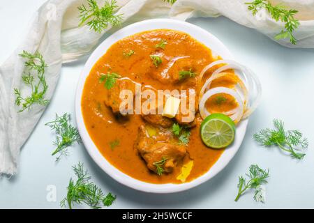 Butter Chicken with makhani sauce in the white plate. Stock Photo