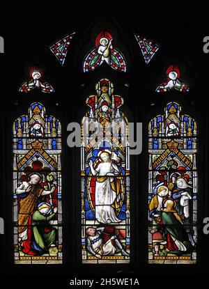 A stained glass window by Lavers Barraud & Westlake of 1890 depicting Jesus Risen, Maries at the Tomb, Sts Peter & John, Burley-on-the-Hill Church Stock Photo