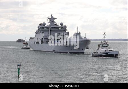 The tugs TEMPEST and INDULGENT escort the Royal Norwegian Navy replenishment oiler HNoMS MAUD towards the harbour entrance Stock Photo