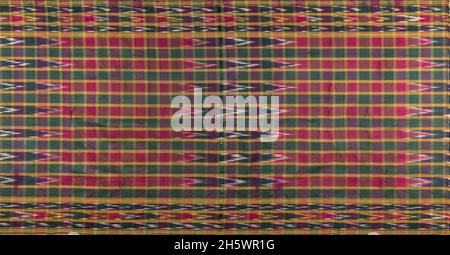 Traditional cloth used by women as a bath towel, Iran.Two pieces of woven fabric with a large plaid pattern in red, green, yellow and black, delineated by narrow yellow stripes. The edges are decorated with simple, geometric patterns using a warp ikat technique Stock Photo