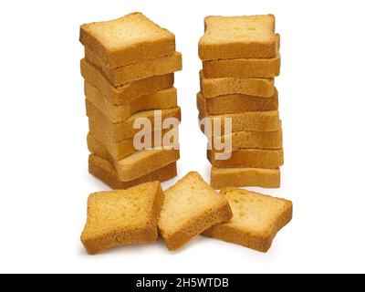 Slices of toasted bread isolated on white, small toasts Stock Photo