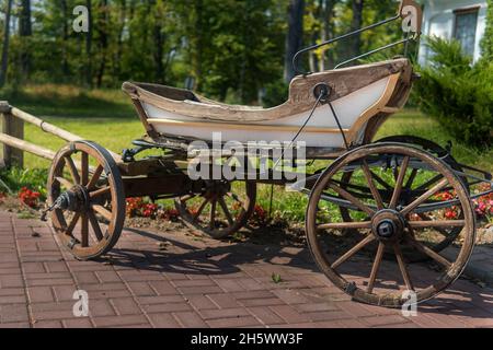 vintage cart for transporting people in the park on a sunny day. Stock Photo