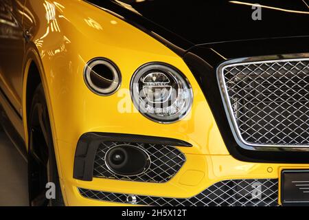 Kiev, Ukraine - May 3, 2019: Yellow Bentley Bentayga Mansory in the city Stock Photo