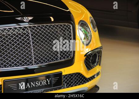 Kiev, Ukraine - May 3, 2019: Yellow Bentley Bentayga Mansory in the city Stock Photo