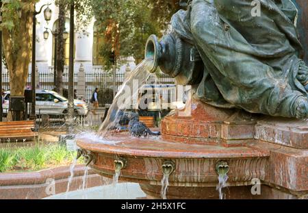 Group of Pigeons Bathing in the Vintage Fountain of Cerro Santa Lucia Foothill's Park in Downtown Santiago, Chile Stock Photo