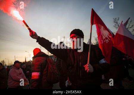 Warsaw, Poland. 11th Nov, 2021. Polish nationalists are burning flares during the Independence March.Poland's National Independence Day marks the anniversary of the country's independence in 1918. It is celebrated as a nationwide holiday on November 11 each year. This year again tens of thousands of Poles took part in the Independence Day March in Warsaw organized by far-right organizations to celebrate the 103rd anniversary of Poland's rebirth as an independent state. The slogan of the march was: 'Independence is not for sale!”. Credit: SOPA Images Limited/Alamy Live News Stock Photo