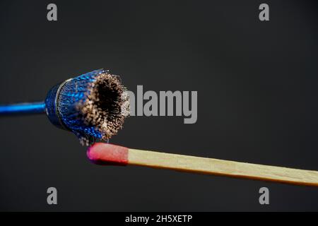 Macro shot of a match with red head Stock Photo