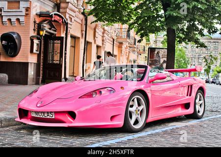 Kiev, Ukraine - June 1, 2013: Pink exclusive supercar Ferrari