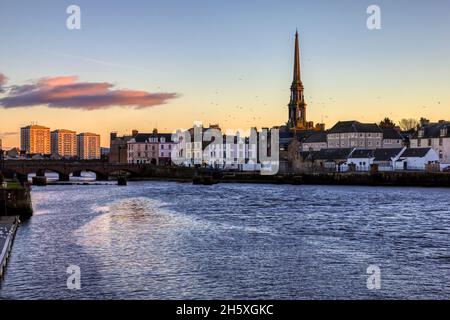 The town of Ayr on the West coast of Scotland. Photographed in the light of the setting sun as it nicely illuminates both the old and new buildings of Stock Photo