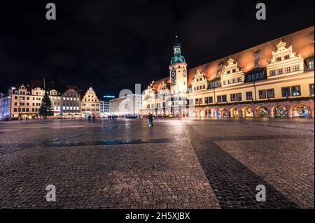 Leipzig, Germany - November 5, 2021: The empty market square in Leipzig (Saxony) at night with old city hall and Christmas tree Stock Photo