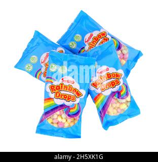 Swizzels Matlow rainbow drops 10g packs sugar coated maize and rice confectionery Stock Photo