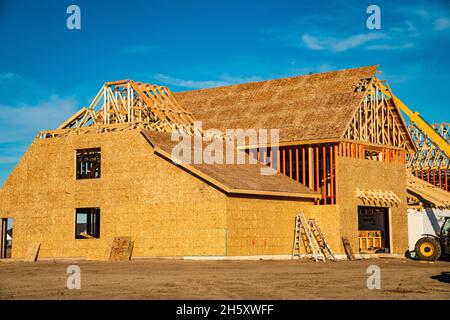 New wood frame home under construction. Stock Photo