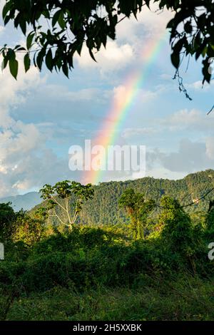 storm clouds and rainbow in the peruvian jungle Stock Photo