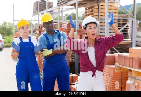 Workers have problems at work at a hardware store Stock Photo