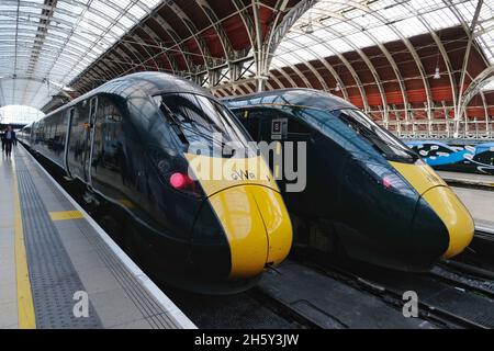 Two Great Western Railway Intercity trains stand at the platform in Paddington Station in London. Stock Photo