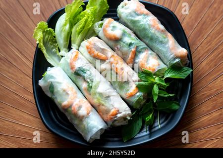 Fresh Roll with shrimp inside and chicken, tofu, bean sprouts, lettuces, mint leaf, cucumber Stock Photo