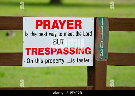 Humorous no trespassing sign on a rural property, Llano County CR 310, Texas, USA Stock Photo