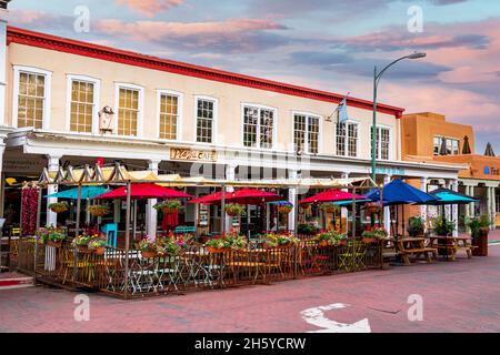 Beautifully decorated outdoor dining area of The Plaza Cafe restaurant in Old Town. Scenic exterior view - Santa Fe, New Mexico, USA - 2021 Stock Photo