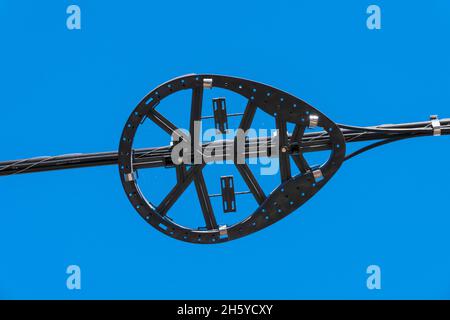 Plastic snow shoe, fiber optic storage, with optical cable against blue sky Stock Photo