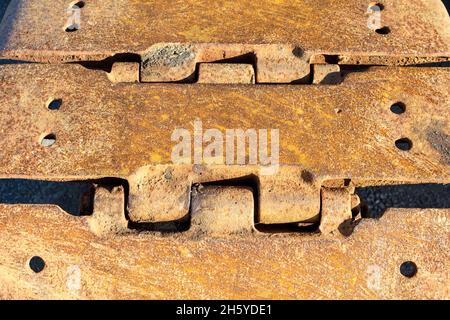 Rusted steel continuous tracks. Close up Stock Photo