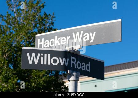 Hacker Way and Willow Road street sign at headquarters of Meta Platforms, Inc., formerly known as Facebook, Inc - MenloPark, California, USA - October Stock Photo
