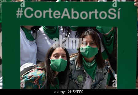 Bogota, Colombia. 11th Nov, 2021. Demonstrators take a photo with a frame that reads 'Court Decriminalize Abortions' as activists from feminist and pro-abortion groups participate in a demonstration in support of the ldecriminalization of Abortions outside the Colombian Constitutional Court house in Bogota, Colombia on November 11, 2021. Credit: Long Visual Press/Alamy Live News Stock Photo