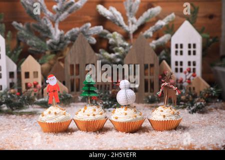 Holiday Cupcakes With Star Sprinkles on Christmas Background Stock Photo