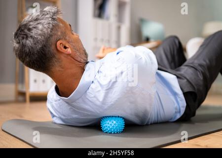 Back Trigger Point Massage Using Spiky Ball Myofascial Release Stock Photo
